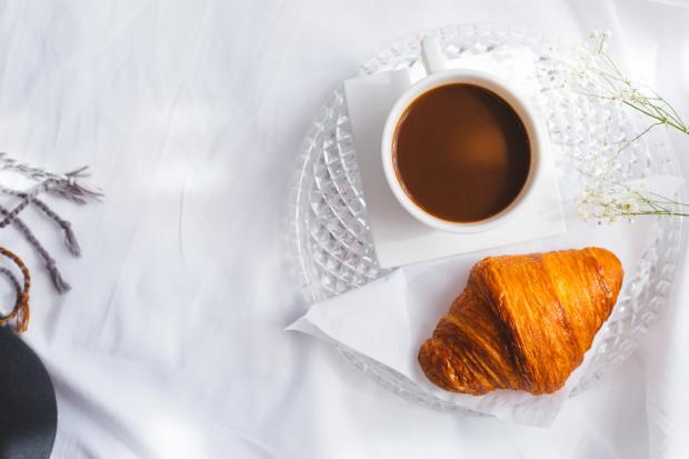 The Bolton News: A croissant and a coffee (Canva)