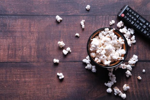 The Bolton News: A bowl of popcorn and a TV remote (Canva)