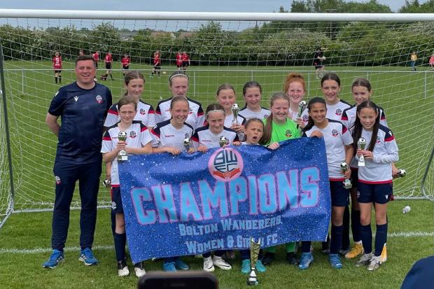 CHAMPIONS: The BWFC Under-12s with coach Carl Halliwell, back left