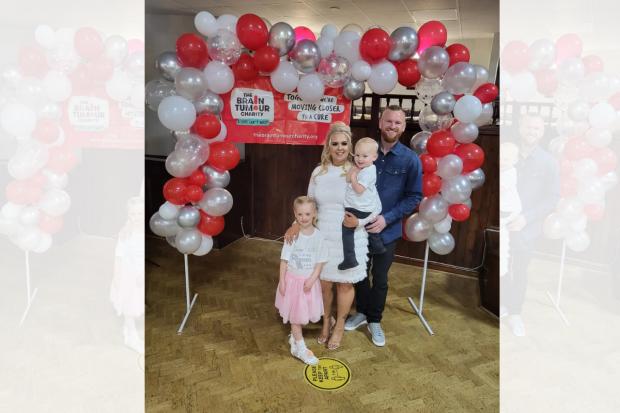 The Bolton News: Christina celebrating with her family during a fundraiser for The Brain Tumour Charity
