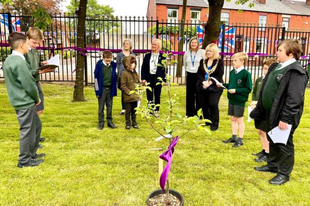 The Bolton News: Pupils were joined by the Mayor of Westhoughton to plant an apple tree