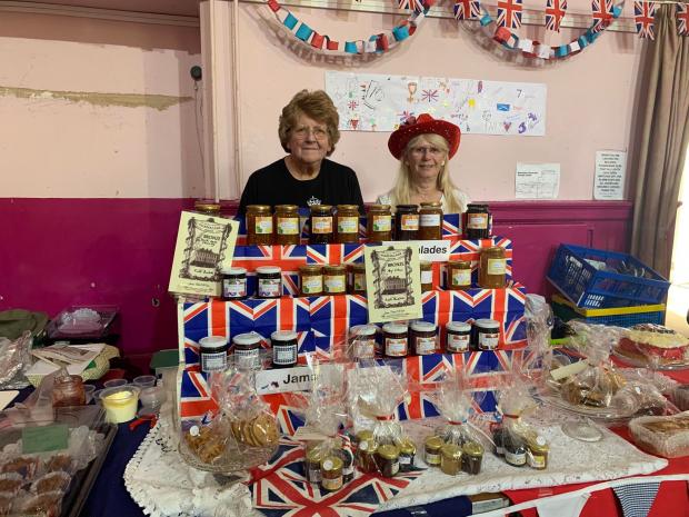 The Bolton News: Kath Rushton and Audrey Mason with their cake and jam stand
