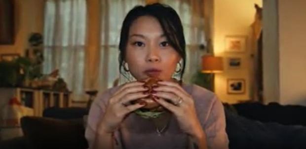 The Bolton News: A shot from the now banned Tesco advert of a woman eating a burger (Tesco/PA)