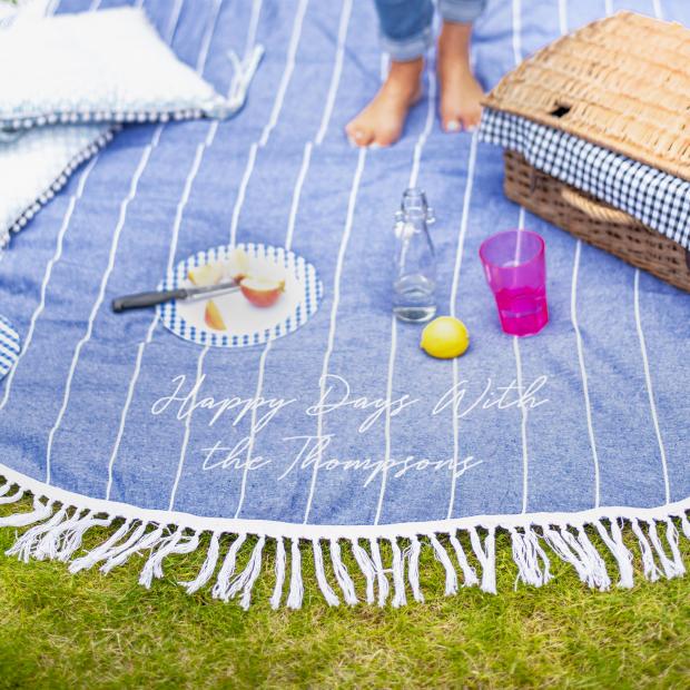 The Bolton News: Personalised Round Blue Picnic Or Beach Blanket. Credit: Not On The High Street