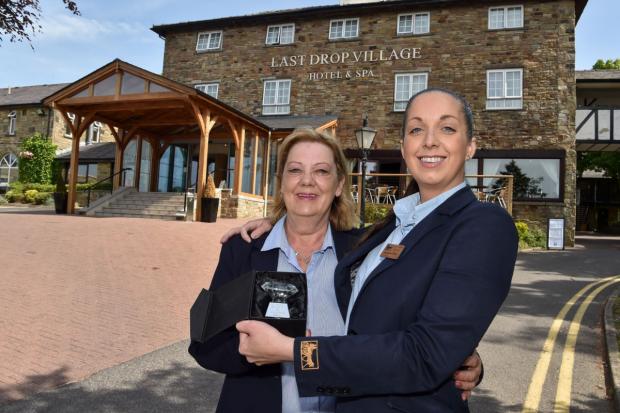 The Last Drop Village Hotel and Spa’s wedding planner Elizabeth Blackmore (left) and wedding co-ordinator Jacqueline Tulloch with the Best Venue in Manchester award from the County Brides North West Wedding Awards 2022