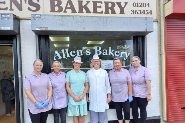 Greg Coop with the staff at Allen's Bakery on the final day of business.