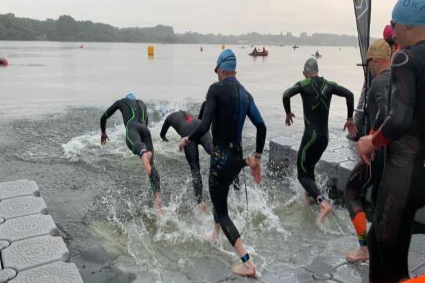Athletes entering the water at Pennington Flash