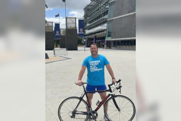 The Bolton News: Andrew will cycle from Manchester to Melbourne. Credit to Carers Trust