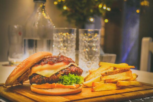 The Bolton News: A burger and chips (Canva)