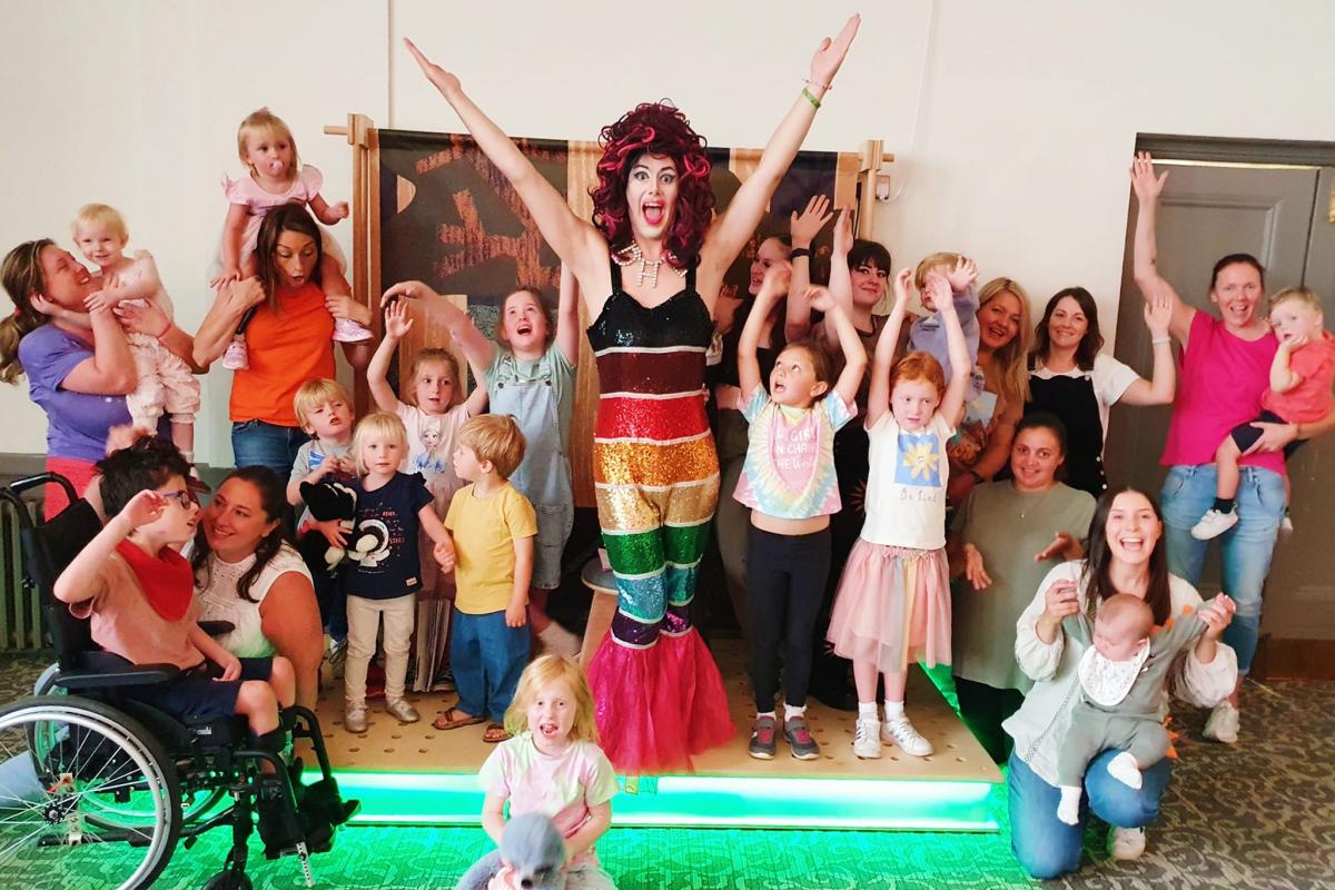 Aida, children and adults at the story hour