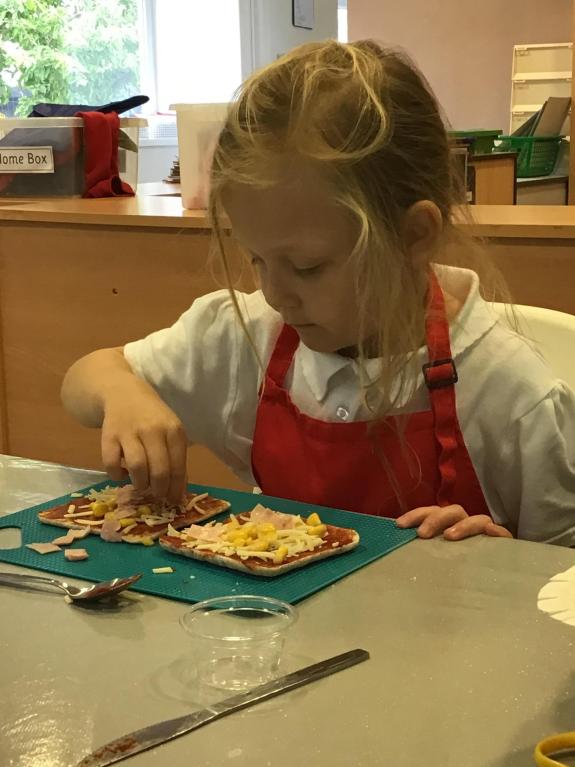 The Bolton News: Poppy creating miniature pizzas at the Nurture Group The Bolton News: Poppy creating miniature pizzas at the Nurture Group