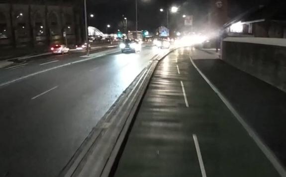 The Bolton News: Headlights at night showing the difference in quality between the road and cycleway on Trinity Street The Bolton News: Headlights at night showing the difference in quality between the road and cycleway on Trinity Street