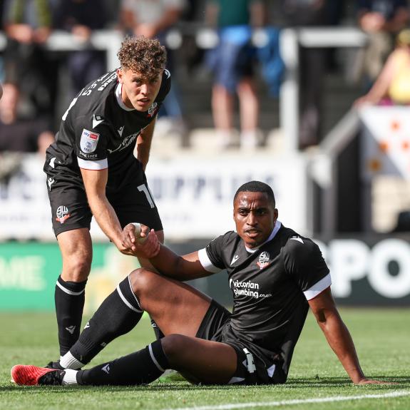 The Bolton News: Dion Charles lends Victor Adeboyejo a hand - the front pair have been productive for Bolton this season The Bolton News: Dion Charles lends Victor Adeboyejo a hand - the front pair have been productive for Bolton this season