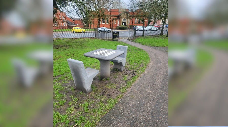 Chess table and chairs set up in Farnworth Park for young people - Vimarsana News