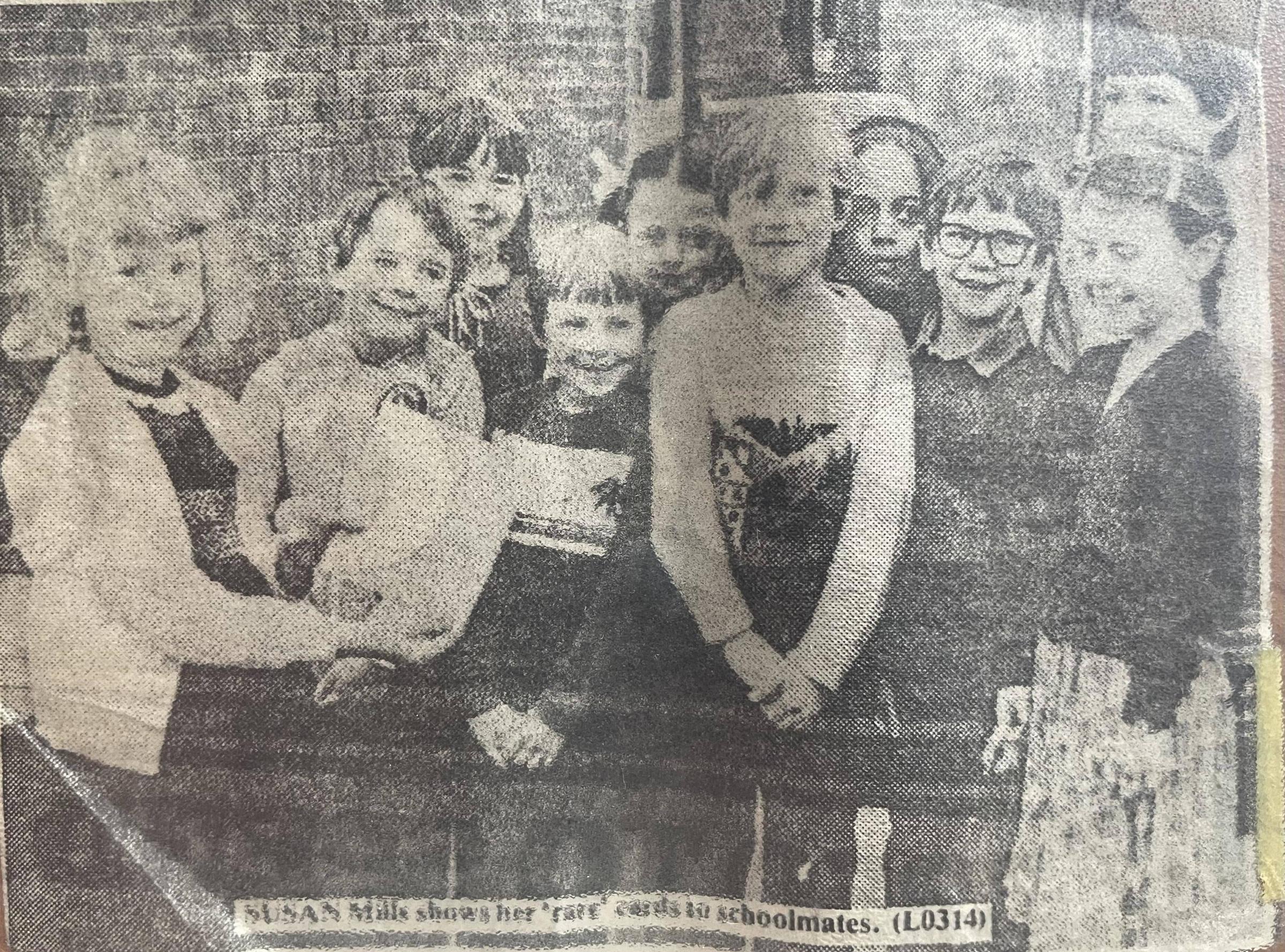 Susan, aged eight, and her friends at Gilded Hollins Primary School in Lowton with some of her birthday cards (from the Leigh Reporter)