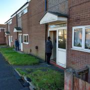 CANVASSING: Labour campaigners knocking on doors in the Brocksby Chase estate in Bolton North East