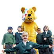 CHARITY TRAIL: Pudsey Bear with St Peter C E Primary School pupils, from left, Kashhiup Lalji aged eight, Thomas Hardwick aged nine, Francesca Hayes aged eight, Dominic Lloyd aged eight and Tegan Tyldesley aged nine