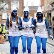 Blue invaders: From left, Sally Wood, Lynzie Wood and Victoria Wray dressed as Smurfs