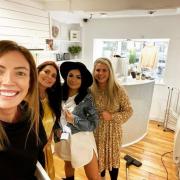 normal: Sammy Kenny, the owner of Village Boutique, pictured alongside some happy customers