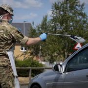 A soldier from 3rd Battalion The Royal Anglian Regiment.Essex Reservists carries covid testing packs to be placed in a refrigeration unit prior to be sent off for testing