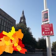 Covid-19 infections reported in each area pictured in front of Bolton Town Hall