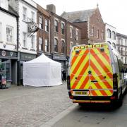 A police tent at the Clean Plate cafe in Gloucester.  May 11, 2021.  Police are today digging under a cafe for the remains of a missing 15-year-old girl feared murdered by serial killer Fred West 53 years ago.  Schoolgirl Mary Bastholm was last seen on 6