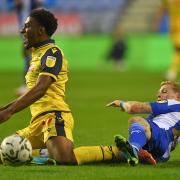 Dapo Afolayan is fouled in the Carabao Cup game at Wigan Athletic.