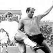 Roger Hunt challenges Oxford United's Ron Atkinson in Bolton Wanderers colours in 1971