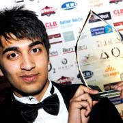 DELIGHTED: Abdul Rahman of Bilal Poultry shows off his Young Entrepreneur of the Year award