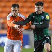 Aaron Morley, right, in action for Rochdale against Blackpool