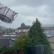 Handout photo taken with permission from the Twitter feed of @john_morgan_wal showing a trampoline flying mid air during Storm Eunice in Builth Wells, mid Wales. Via PA.