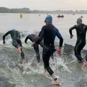 Athletes entering the water at Pennington Flash