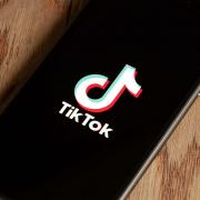 TikTok logo displayed on phone. Credit: PA
