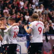 Wanderers celebrate the winning goal from Conor Bradley against Morecambe