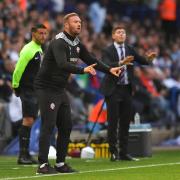 Ian Evatt gives his side instruction from the sideline against Aston Villa