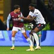 Bolton Wanderers' Ricardo Santos battles with Aston Villa's Philippe Coutinho