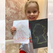 Taliah with her drawings of The Queen