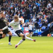 Bolton Wanderers' Conor Bradley shoots for goal but it goes wide