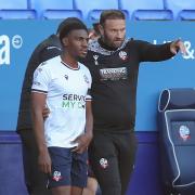 Bolton Wanderers manager Ian Evatt talks to Oladapo Afolayan as he comes on as a substitute in the 70th minute