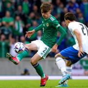 Conor Bradley in action for Northern Ireland against Greece