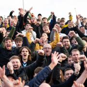Wanderers fans celebrate victory at Accrington Stanley