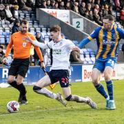 Conor Bradley in action for Wanderers against Shrewsbury Town