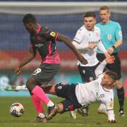 Bolton Wanderers' Dion Charles in action with Exeter City's Cheick Diabate