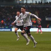 Conor Bradley celebrates his goal against Exeter City for Bolton Wanderers