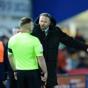 Ian Evatt complains to the referee's assistant after Poole's challenge on George Johnston