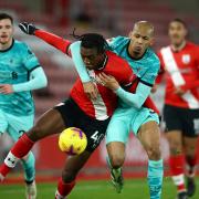 Dan Nlundulu in action for Southampton against Liverpool in the Premier League
