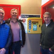 Alun Wall, Jez Jarratt, and Phil Wykes from Bolton Orthopaedics with the newly installed defibrillator