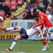 Bolton Wanderers' Dion Charles controls the ball under pressure from Charlton Athletic's Matt Penney
