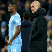 Wanderers' new loan signing Luke Mbete stood with his Manchester City boss Pep Guardiola.
