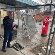 Cllr Sean Hornby next to the post-box which has been blocked off